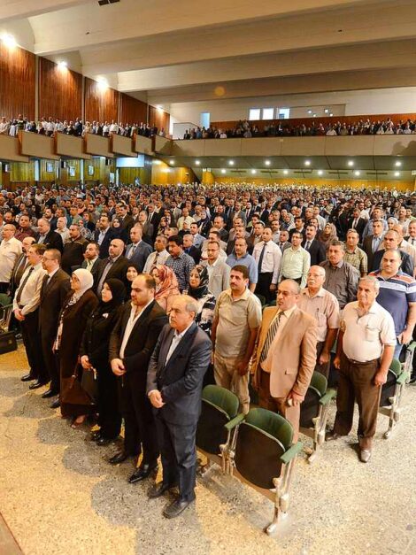 Faculty and researchers in a conference hall