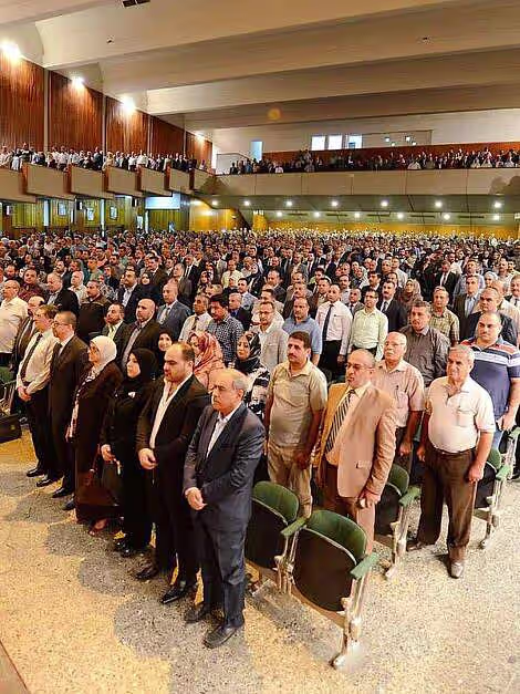 Faculty and researchers in a conference hall