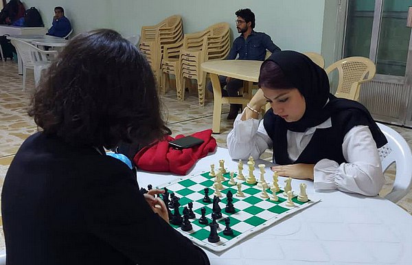 activities Two female students playing chess
